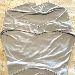 Light blue dolman sleeve top.